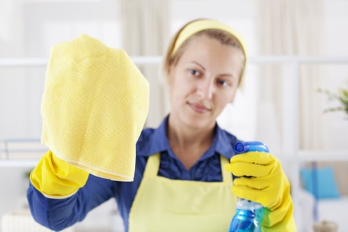 Professional oven cleaner in Brent cleaning a greasy oven interior