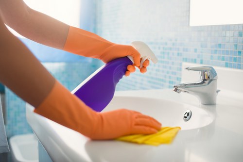 Cleaner reviewing safety procedures and workplace risks
